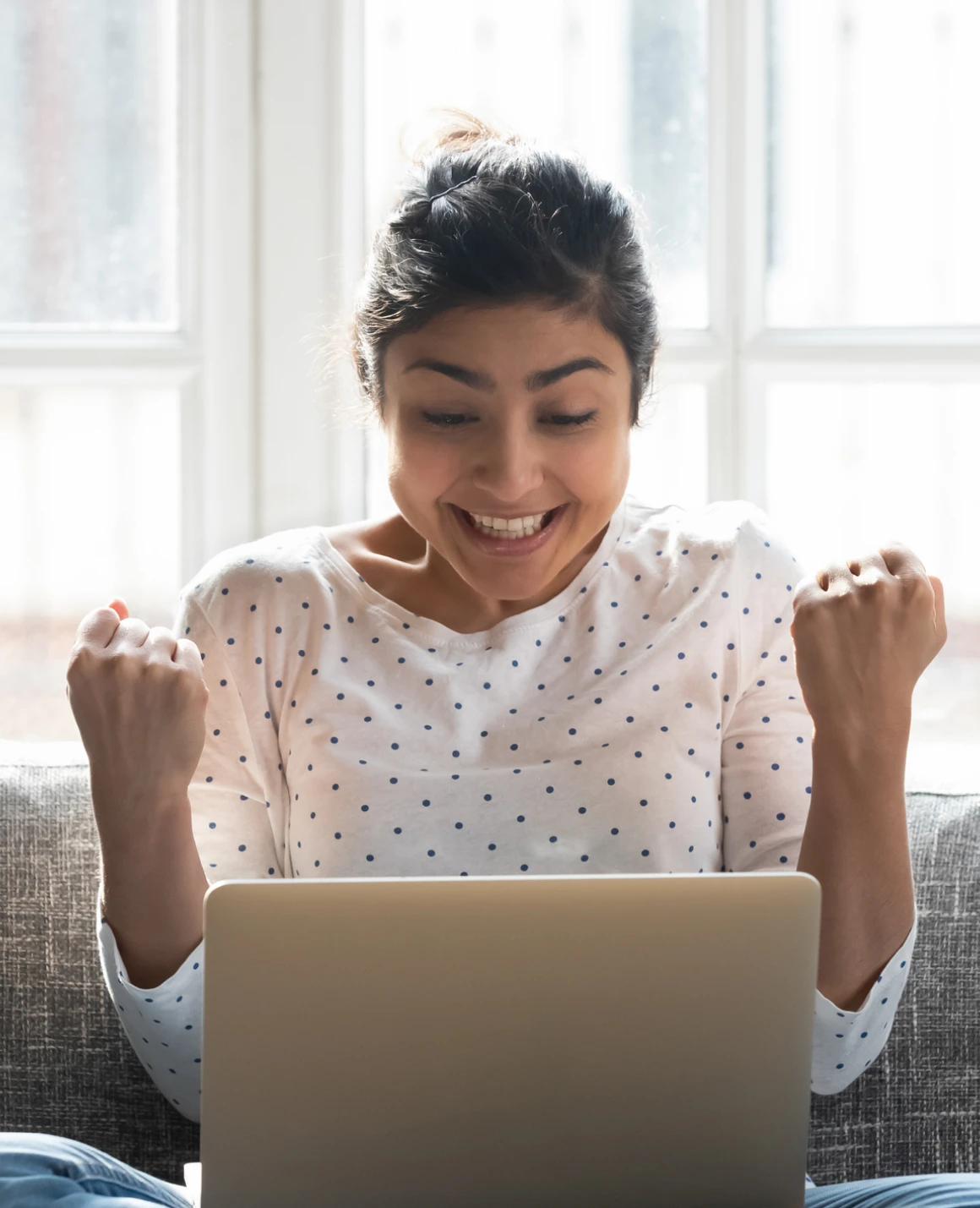Woman with fists raised in triumph