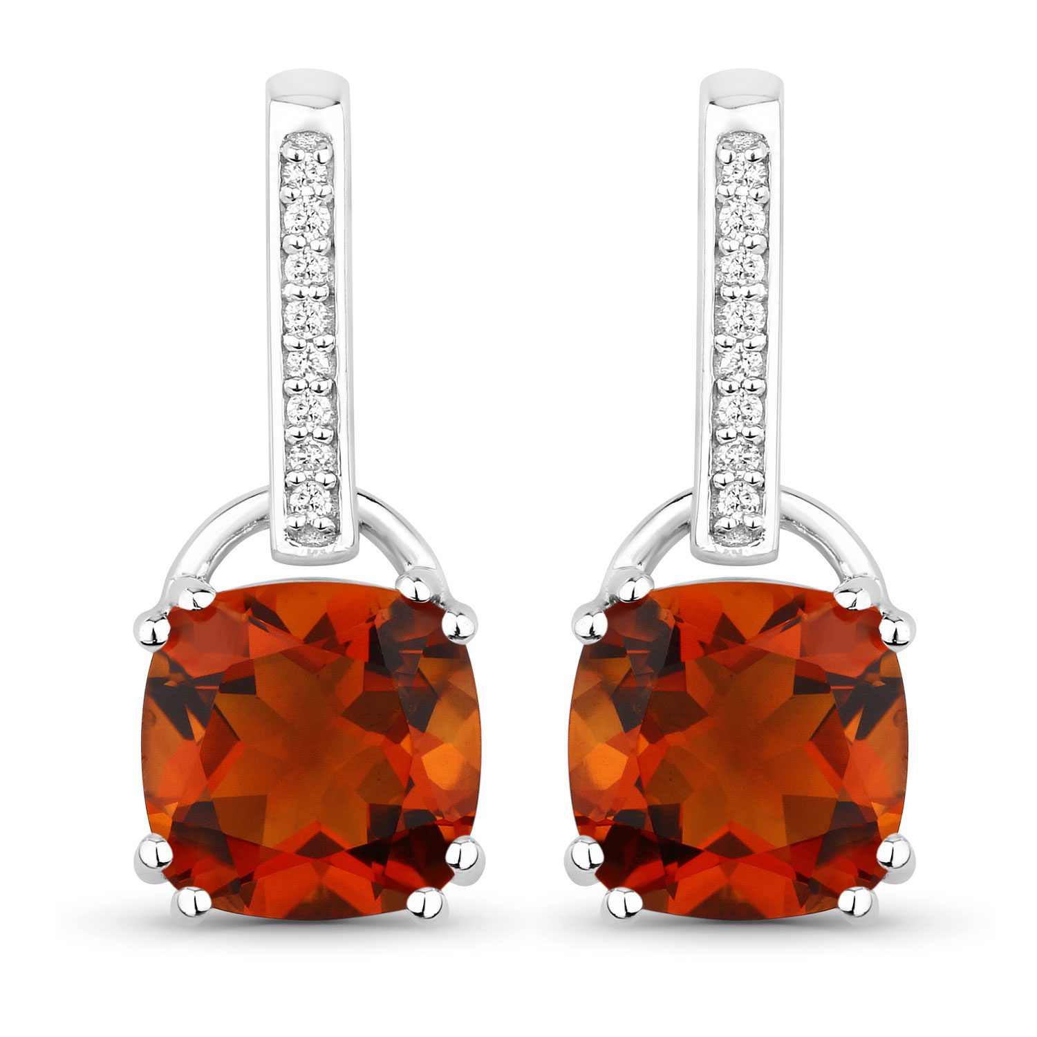 Silver earrings with orange gemstones and diamonds.
